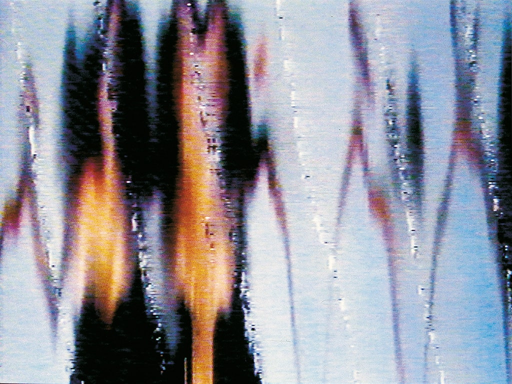 Abstract image of vertical, blurred, orange and black shapes against a light blue background, with wavy lines and a distorted, glitched appearance resembling sound waves or reflections.